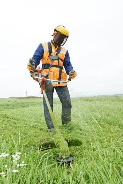 Botlebembali grounds-maintenance worker cutting grass
